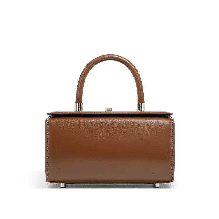 Brown leather women's crossbody bag with a single shoulder strap and clamshell opening.