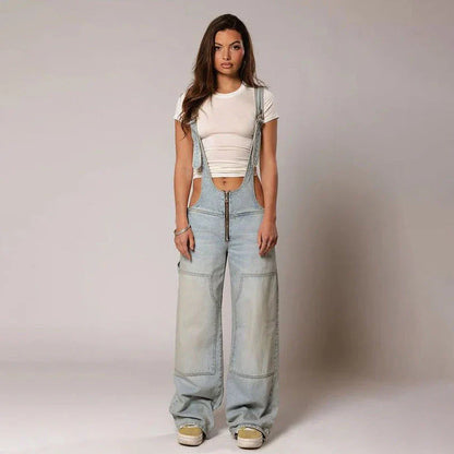 Stylish Y2K-inspired denim suspender jumpsuit with pockets, featuring a relaxed wide-leg silhouette and adjustable straps for a customized fit.