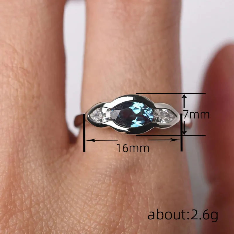 Women's geometric ellipse ring with inlaid zircon stones in white gold finish on copper