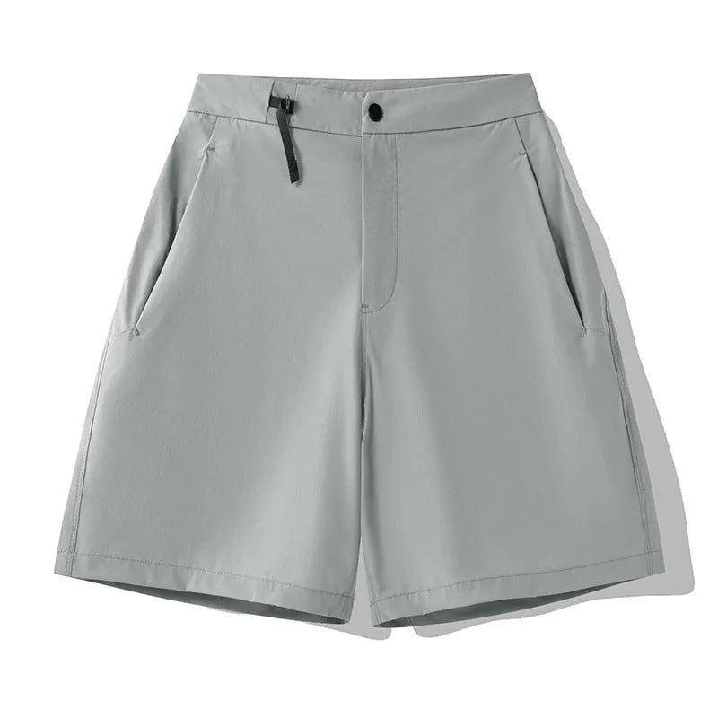 Man wearing solid-colour quick-dry sports shorts with an elastic waistband for running or climbing.