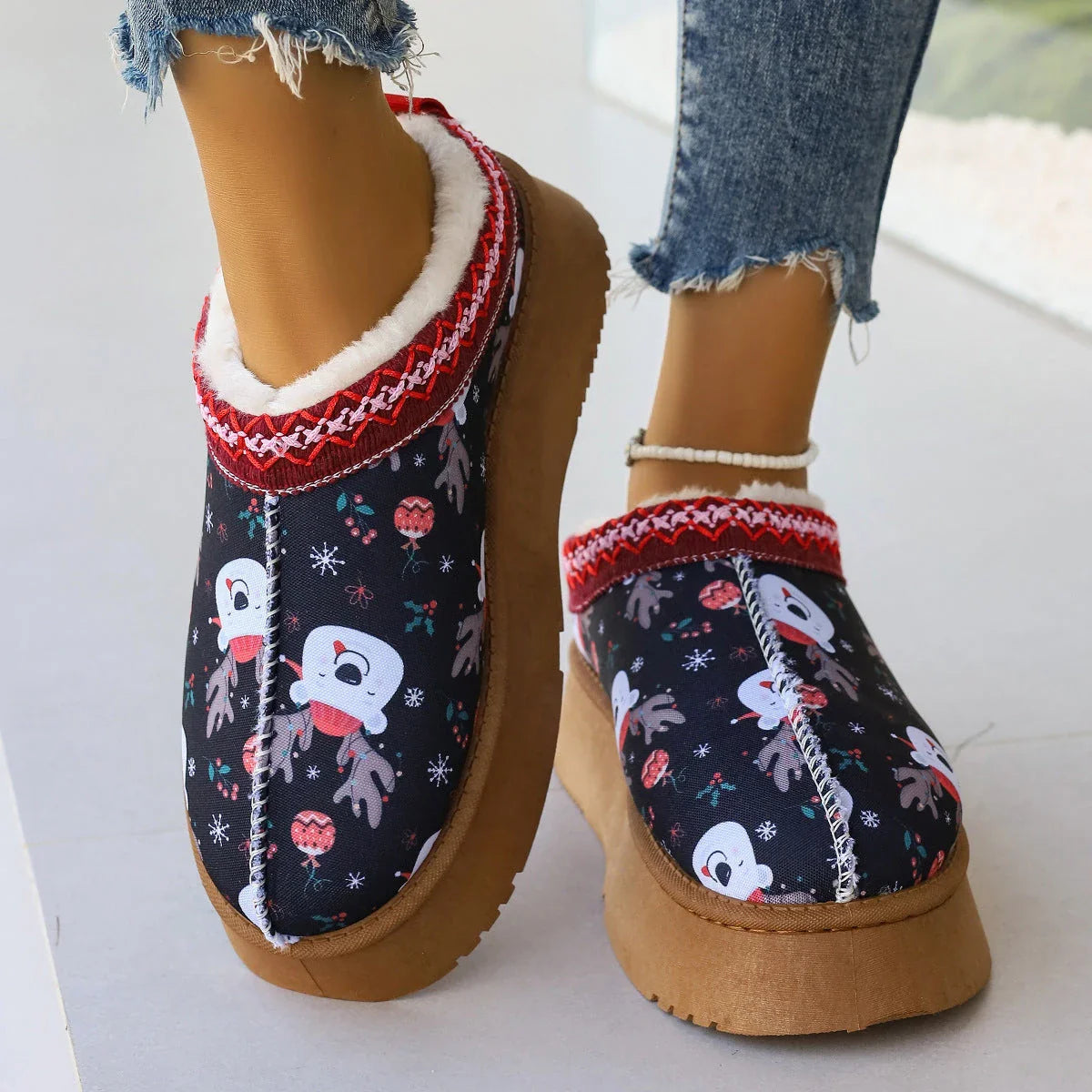 Cozy women's Christmas ankle boots with plush lining and slip-on design in festive snowman, bear, red, and Santa Claus designs