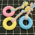 Non-toxic rubber dog chew toy with surface particles, star ring ball shapes, pink blue yellow