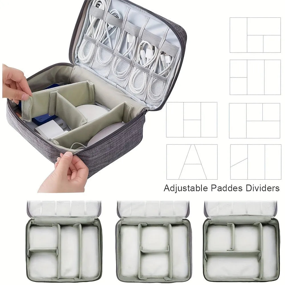 Black and grey waterproof travel cable organiser bag open, showing mesh pockets and removable padded dividers inside.