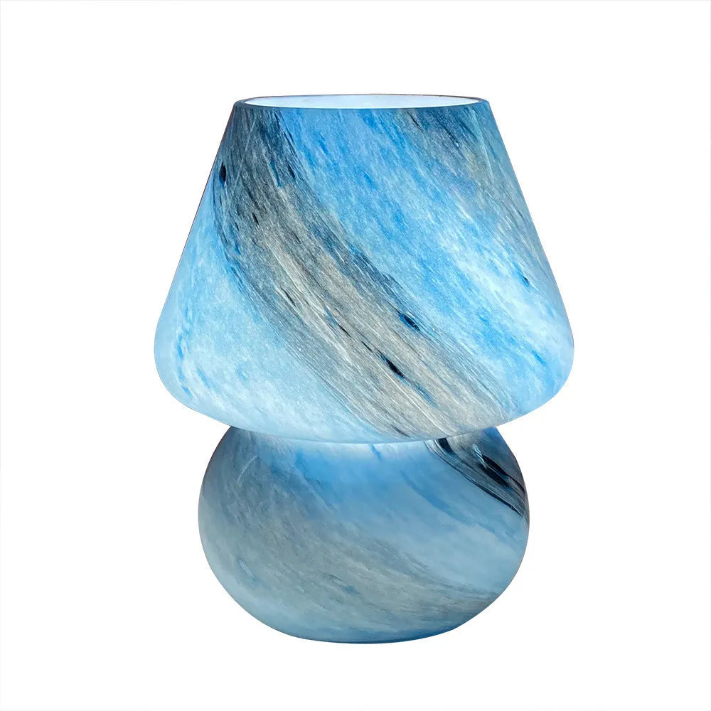 Handmade glass mushroom table lamp in Earth colour on wooden bedside table, 15cm by 19cm