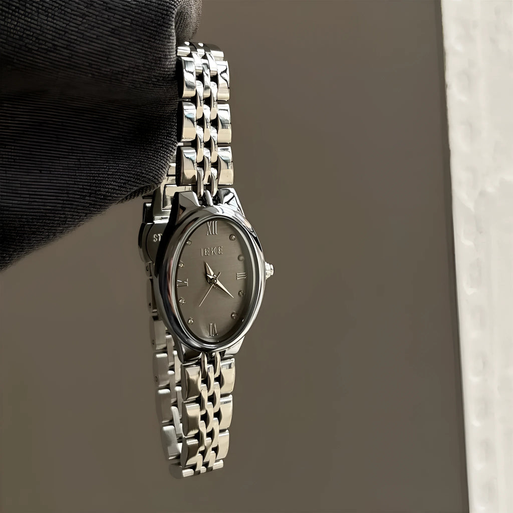 Oval dial watch with 37mm case, 10mm thickness, dot markers, and stainless steel butterfly clasp in gold or silver