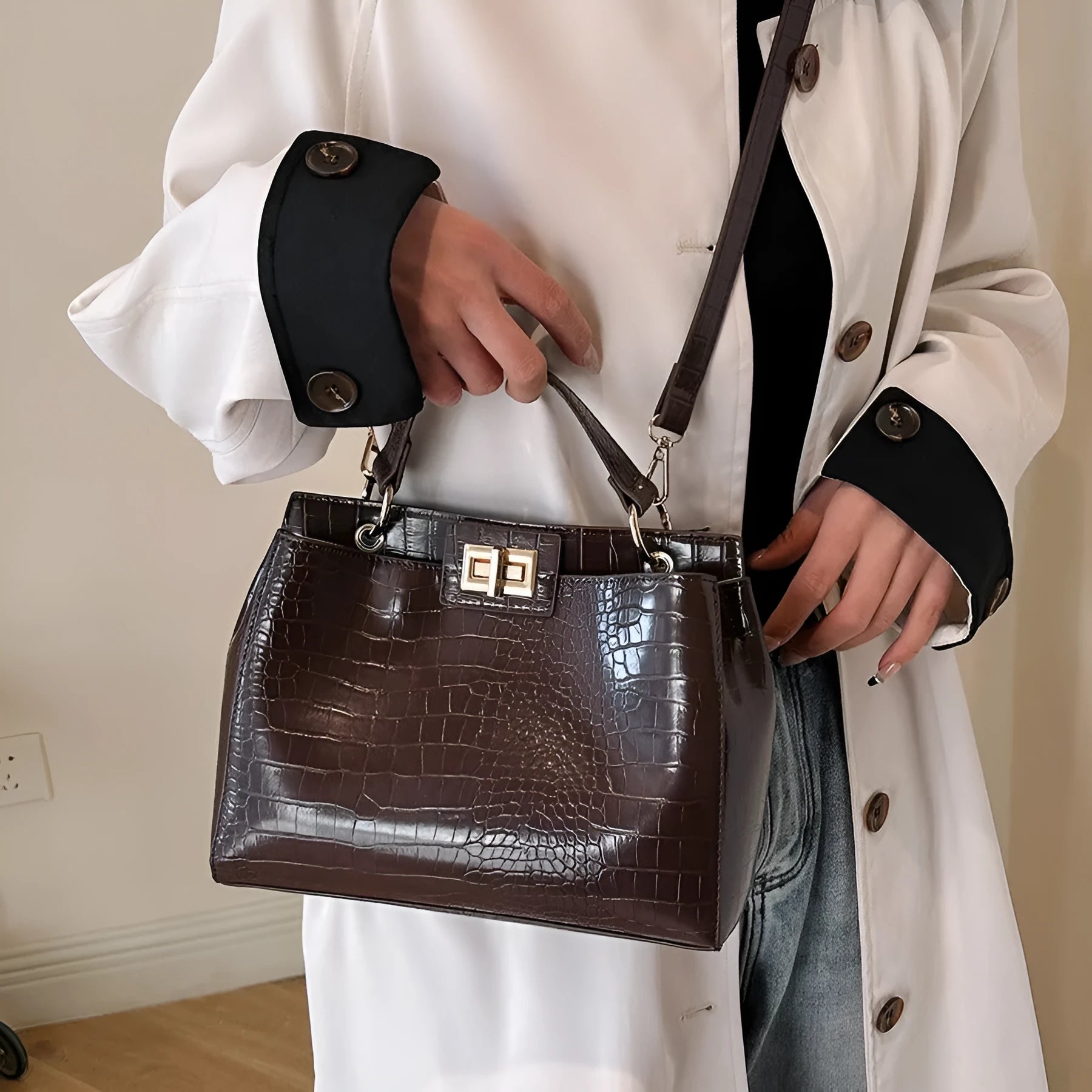 Retro western style messenger bag in black stone pattern with shoulder strap and square vertical shape