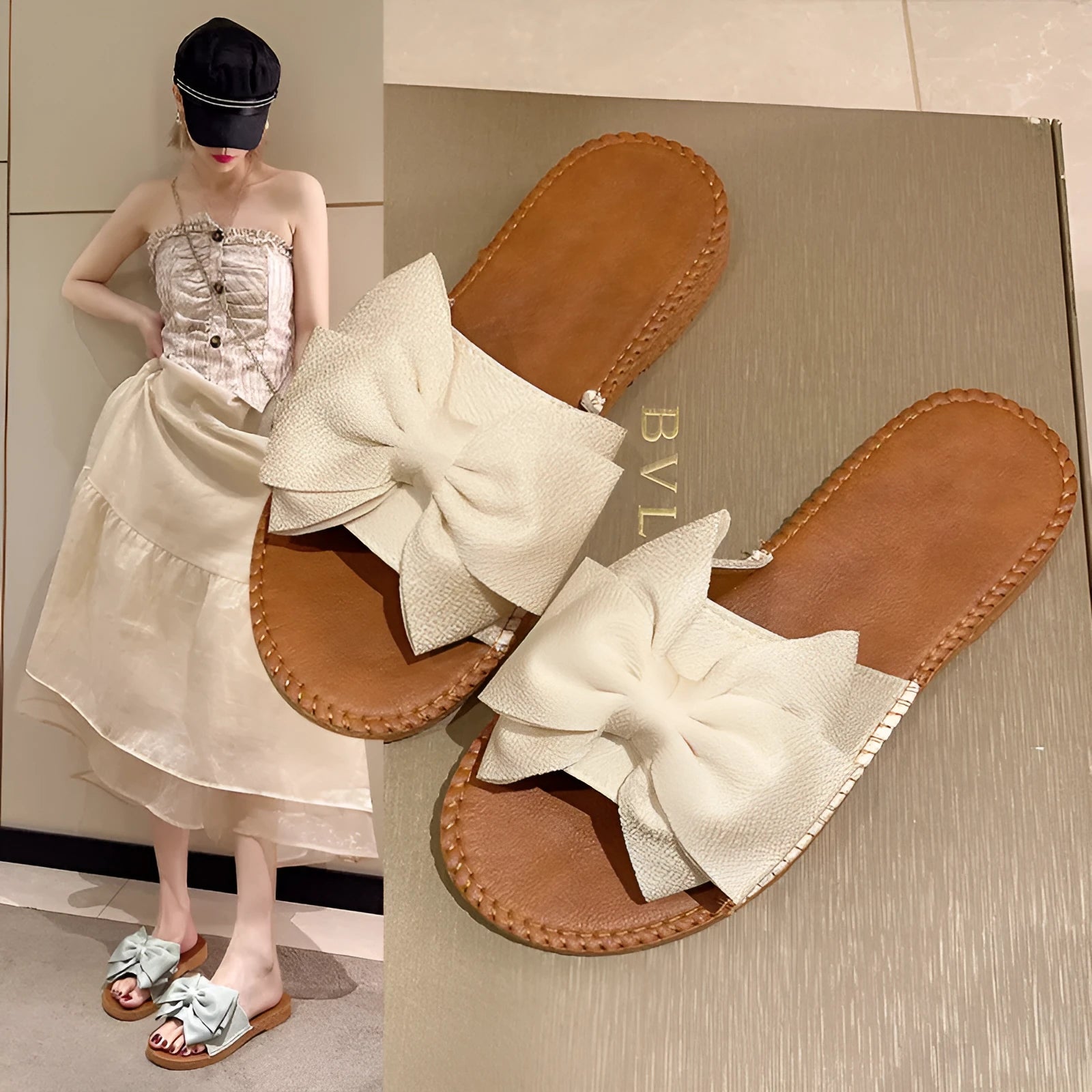 Women's beige slip-on sandals with a bow detail, suede cloth upper, and soft rubber flat sole.
