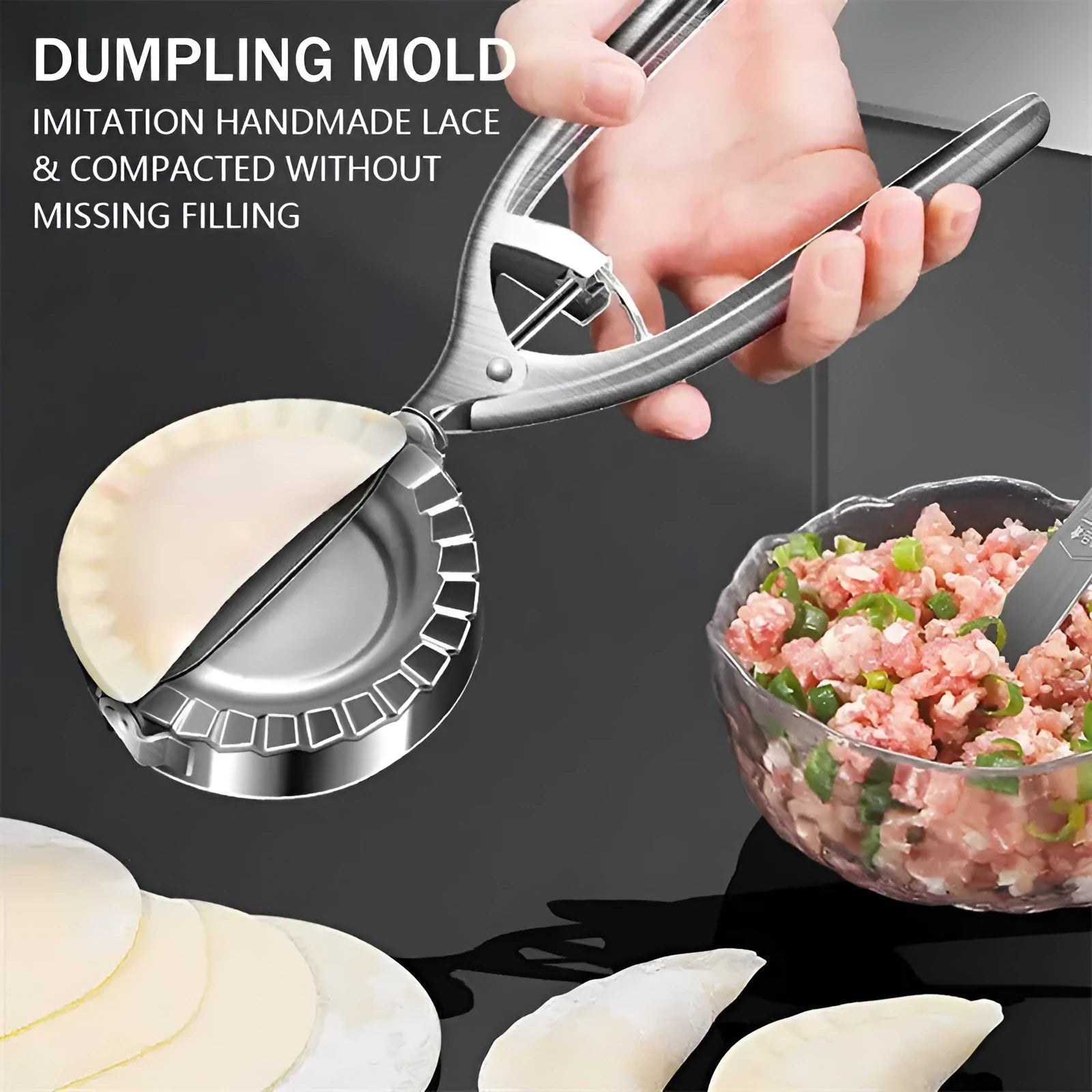 Silver stainless steel manual dumpling maker tool for pressing homemade dumplings.
