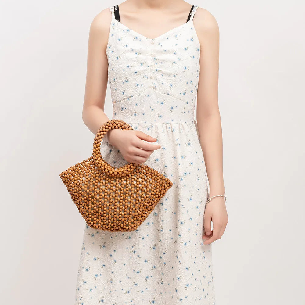 Hand-woven wooden bead beach handbag dumpling shape turmeric colour 13x7x18cm