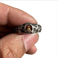 Hand-forged copper Grotto Buddha ring with a rock texture surface, shown in size 8.