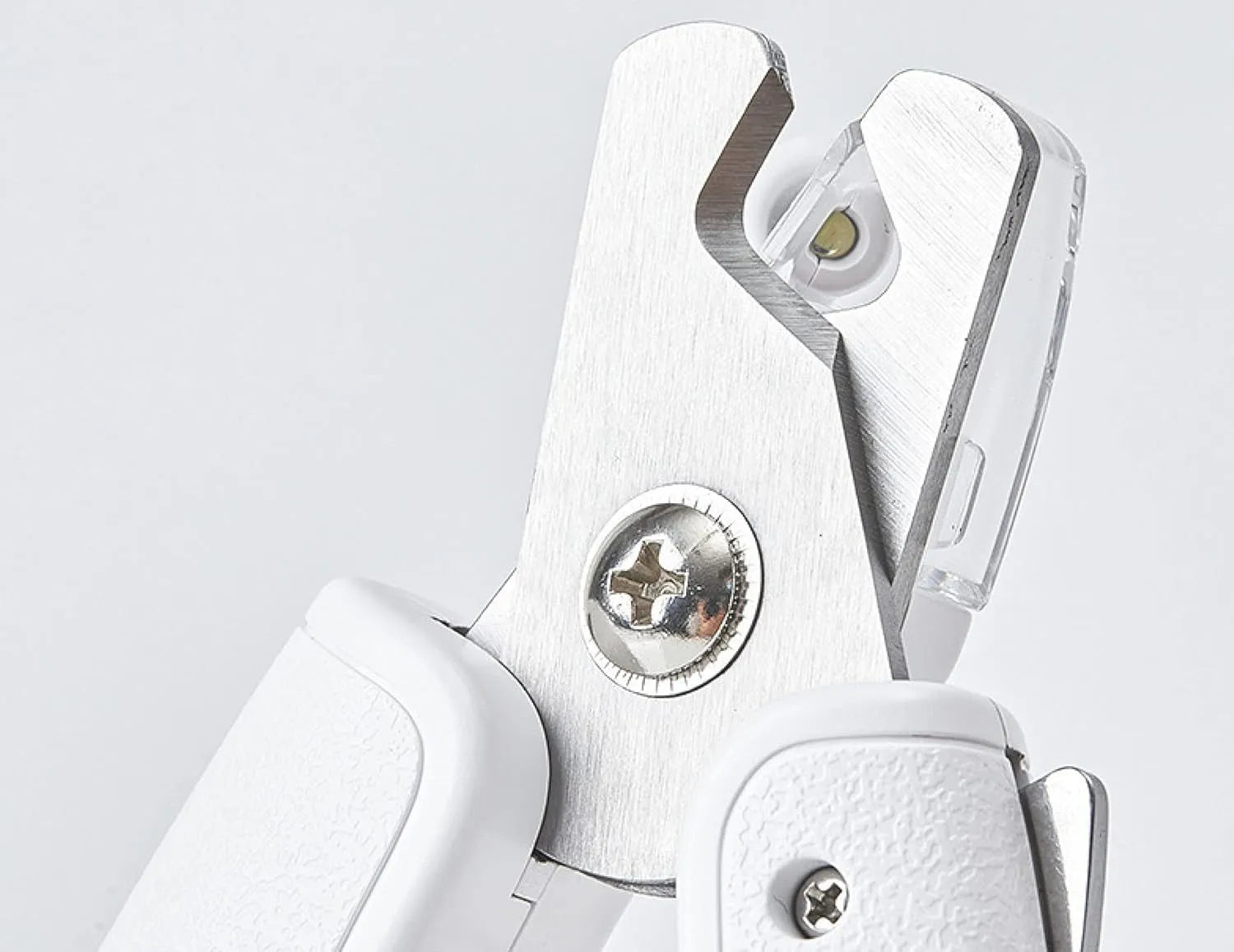 White LED pet nail clippers with a transparent anti-splash guard and an integrated nail file on a grey background.