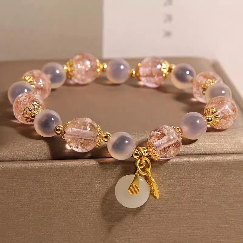 Women's pink heart agate bracelet with peace buckle closure and luminous glaze details