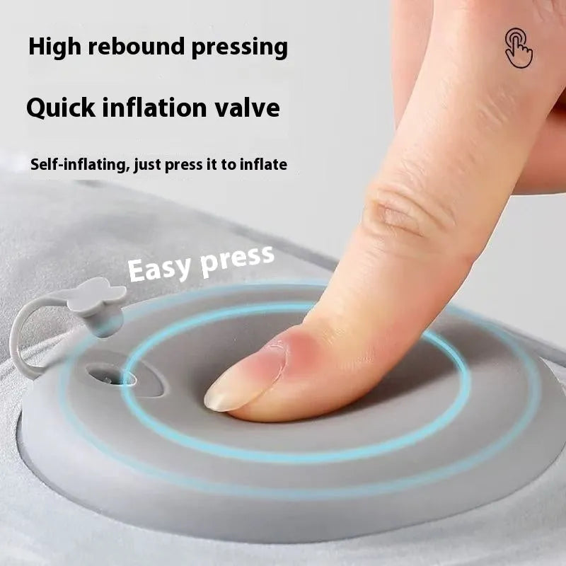 Press inflatable flocked seat cushion shown deflated and folded next to a chair.