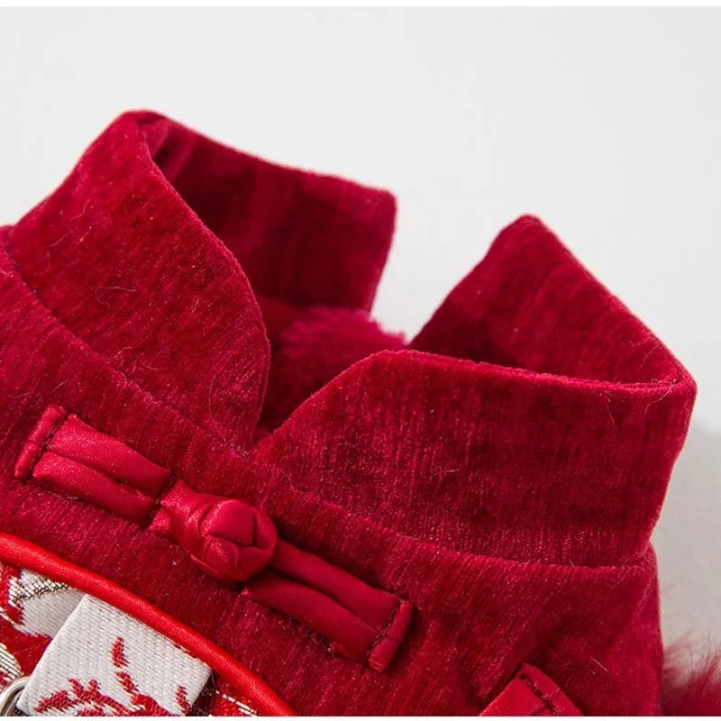Chinese-style pet Tang Suit jacket in red with stand-up collar and fluffy trim on small dog