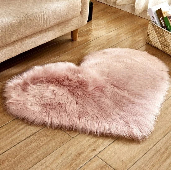 Soft and plush heart-shaped rug in various colors, perfect for cozy home decor