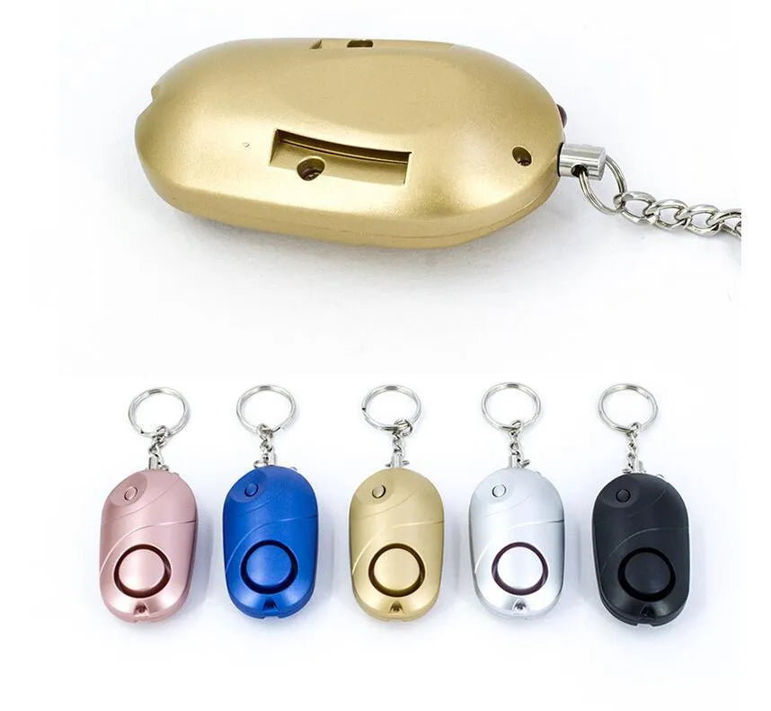 High decibel personal alarm pager keyring with 130dB siren, LED flashlight, and lanyard activation in black.