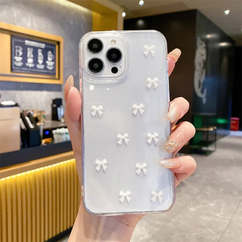 Epoxy glitter bow silicone iPhone case in white, black, purple, or red for iPhone 11 to 16 Pro Max.