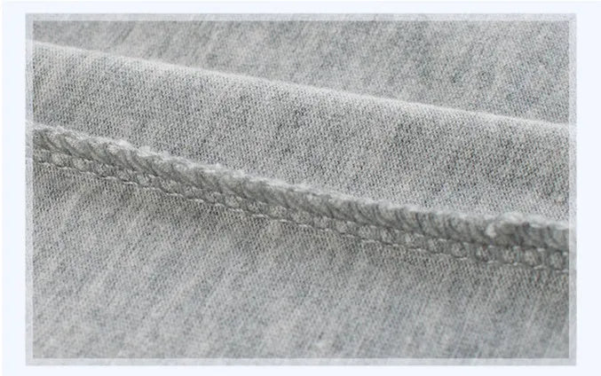Grey cotton children's t-shirt shown with a size chart listing measurements from 90cm to 140cm.