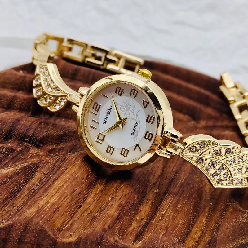 Women's stainless steel watch with a round dial shown in gold, golden white, and black/gold surface options.