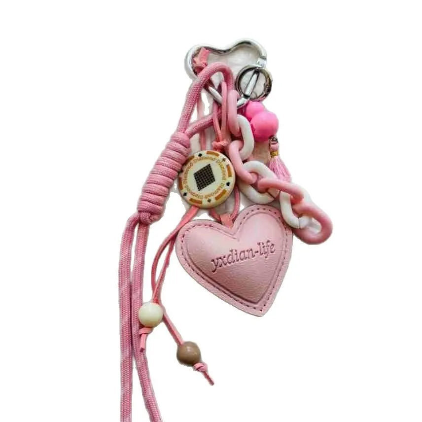 Leather keychain with heart-shaped small gourd pendant in brown, woven rope strap