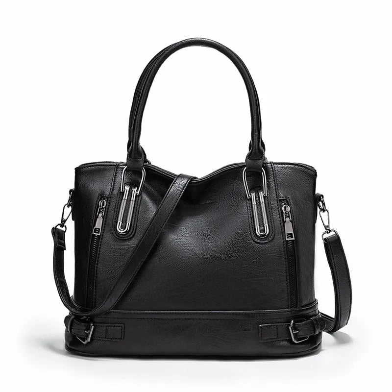 Women's PU leather handbag in black, horizontal square shape, with crossbody strap and sewing line detail