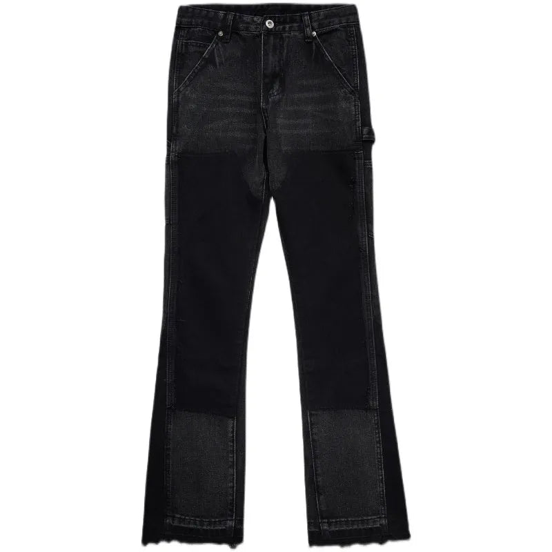 Women's micro flared patchwork raw edge jeans in black denim with loose straight tube fit, front view