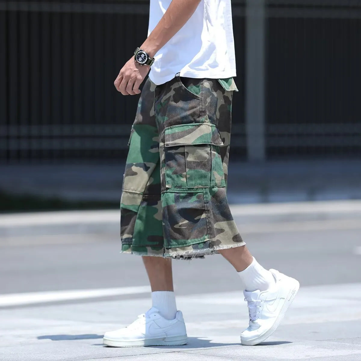 American retro workwear shorts in camouflage pattern with loose cropped fit