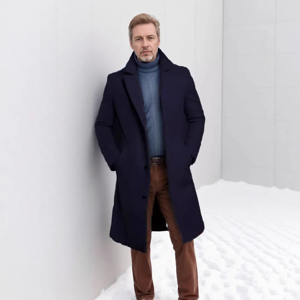 Men's mid-length solid colour woolen coat in dark gray, side view, showing thick fabric and side seam pocket.