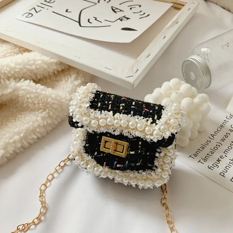 Children's diamond lattice chain crossbody bag in black with cotton cloth exterior, Velcro closure, and 110cm shoulder strap