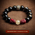 Carved cinnabar bead bracelet with animal zodiac designs in gold or silver colour
