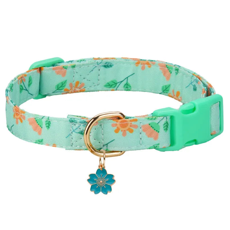 Adjustable polyester floral dog collar in Pink with buckle and slide adjuster on white background