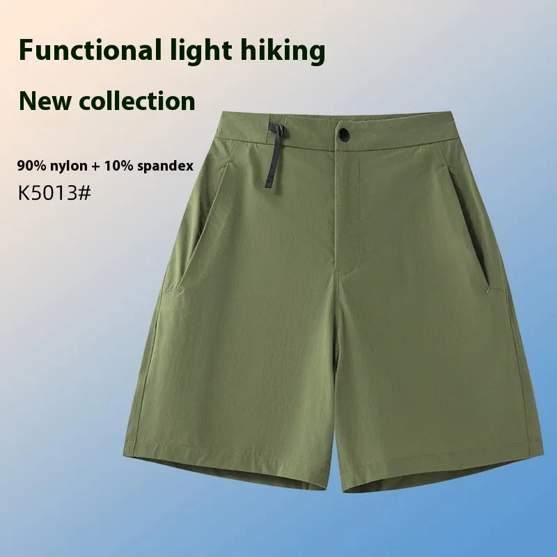 Man wearing solid-colour quick-dry sports shorts with an elastic waistband for running or climbing.