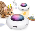 White automatic cat toy with feathers and cleaning ring on floor