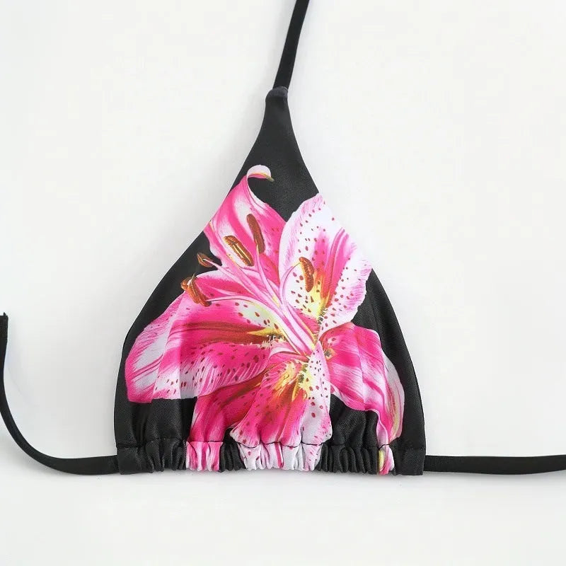 Women's printed bikini three-piece set with black red flowers and matching wrap skirt in polyester