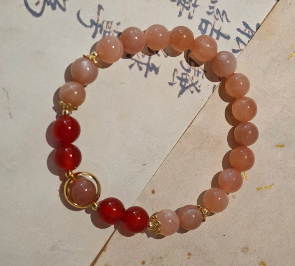 Handmade red agate and Sunstone bracelet with 8mm beads, star design, and ethnic Xiangyun patterning