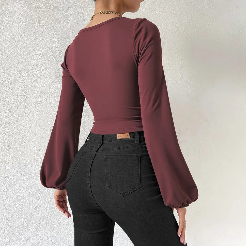Wine red long-sleeved slim fit shirt with retro lantern sleeves and collage patchwork detail on polyester fabric