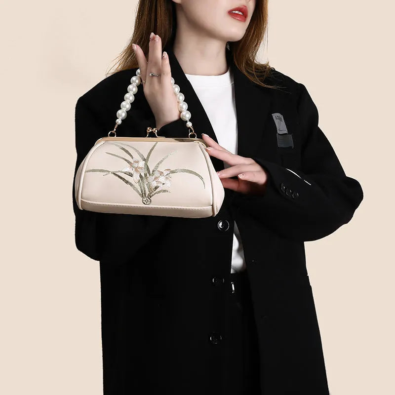 Beige embroidered women's shoulder bag with shell-shaped design in soft PU leather