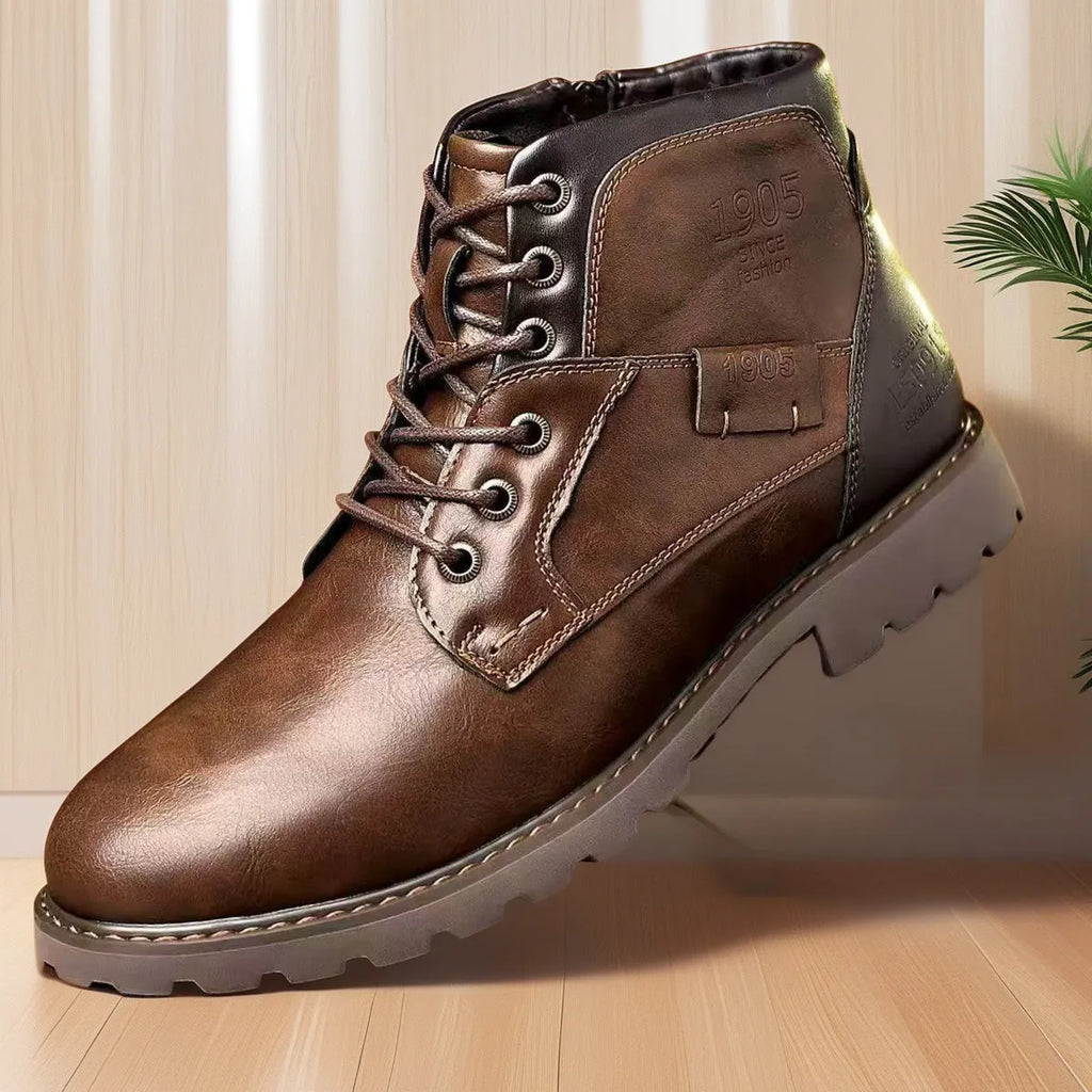 Men's brown ankle boot with a side zip fastening and round toe on a rubber sole.