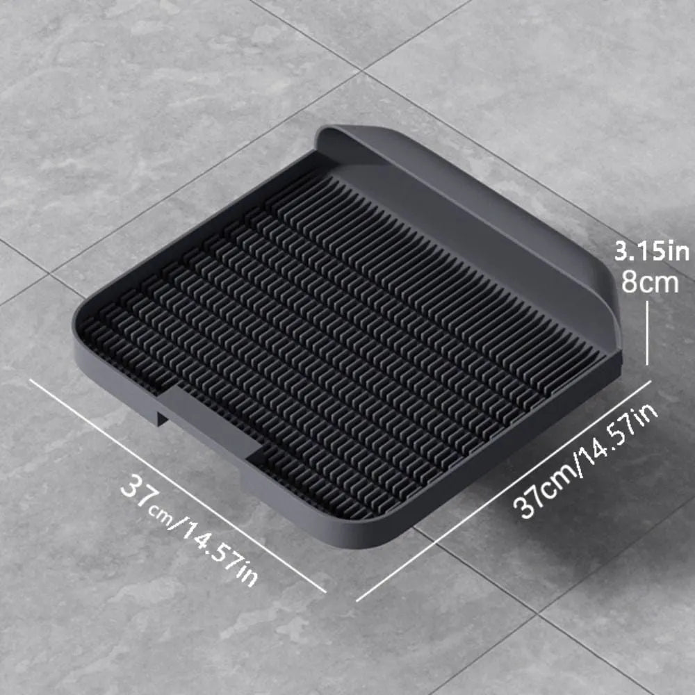 Large black cat litter pedal with slanted mouth design and textured surface for litter containment