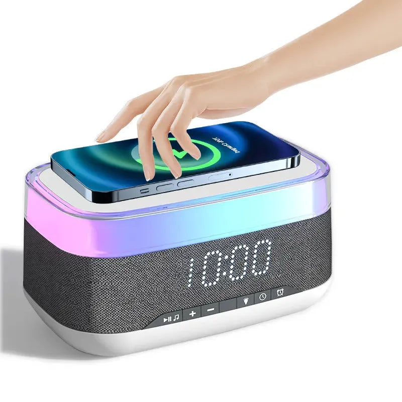White multifunctional alarm clock with Bluetooth speaker, wireless charging pad, and ambient night light.