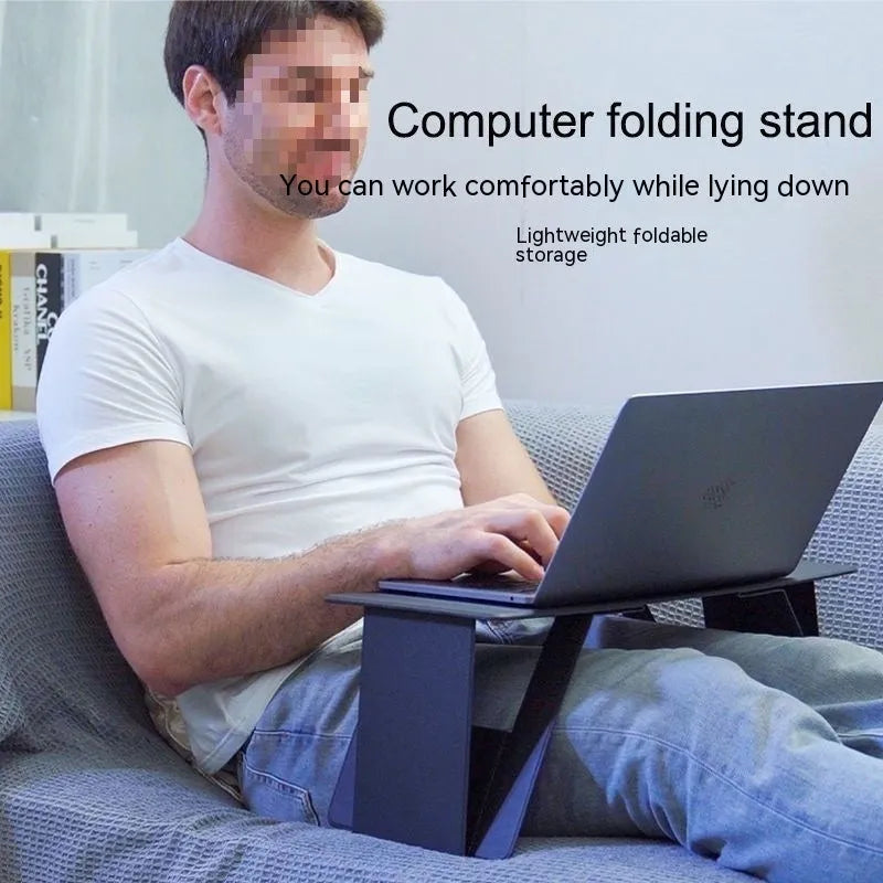 Foldable wooden laptop tablet stand in black, standard size, with legs open on a flat surface