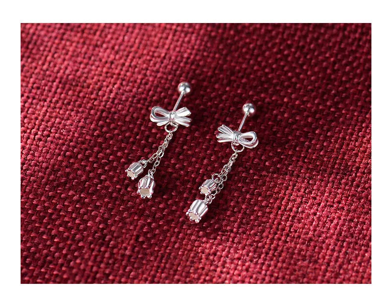 Silver bow eardrops with sweet tassel bone stud design for women