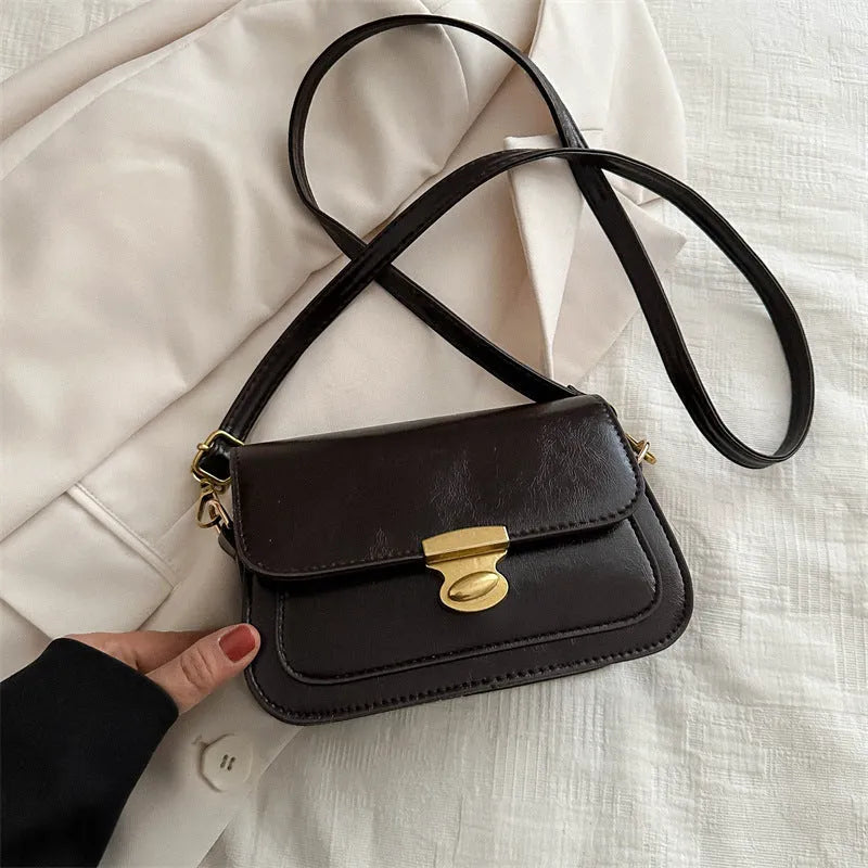 Retro small square handbag in soft brown PU leather with horizontal orientation