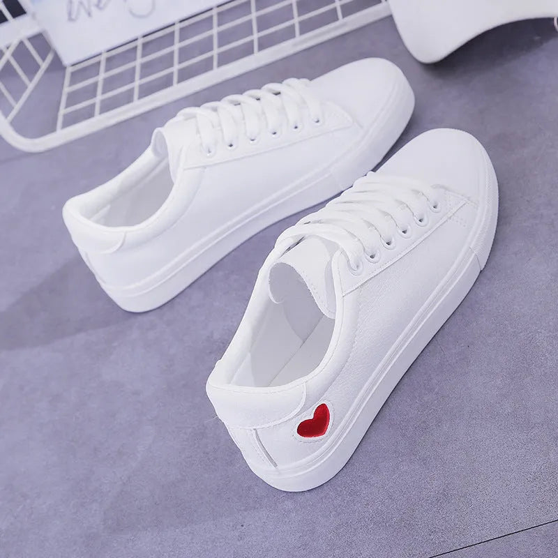 Women's PU leather heart flats shoes with colourful beads and stainless steel pendant on white background