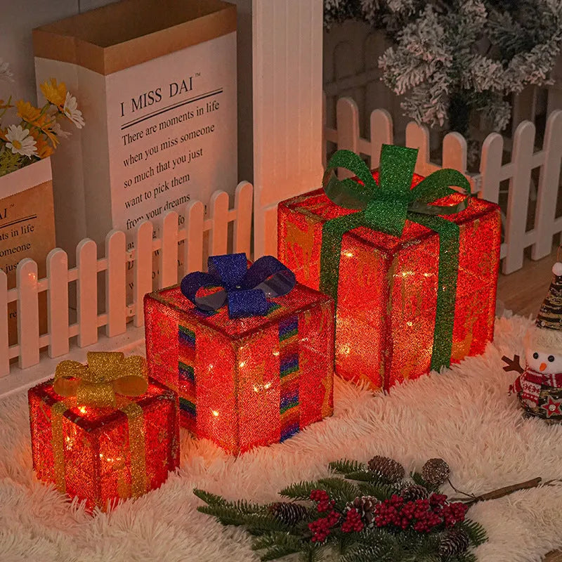Set of three LED lighted Christmas gift boxes with red bows, showing warm white and multicolour light modes for outdoor holiday decor.