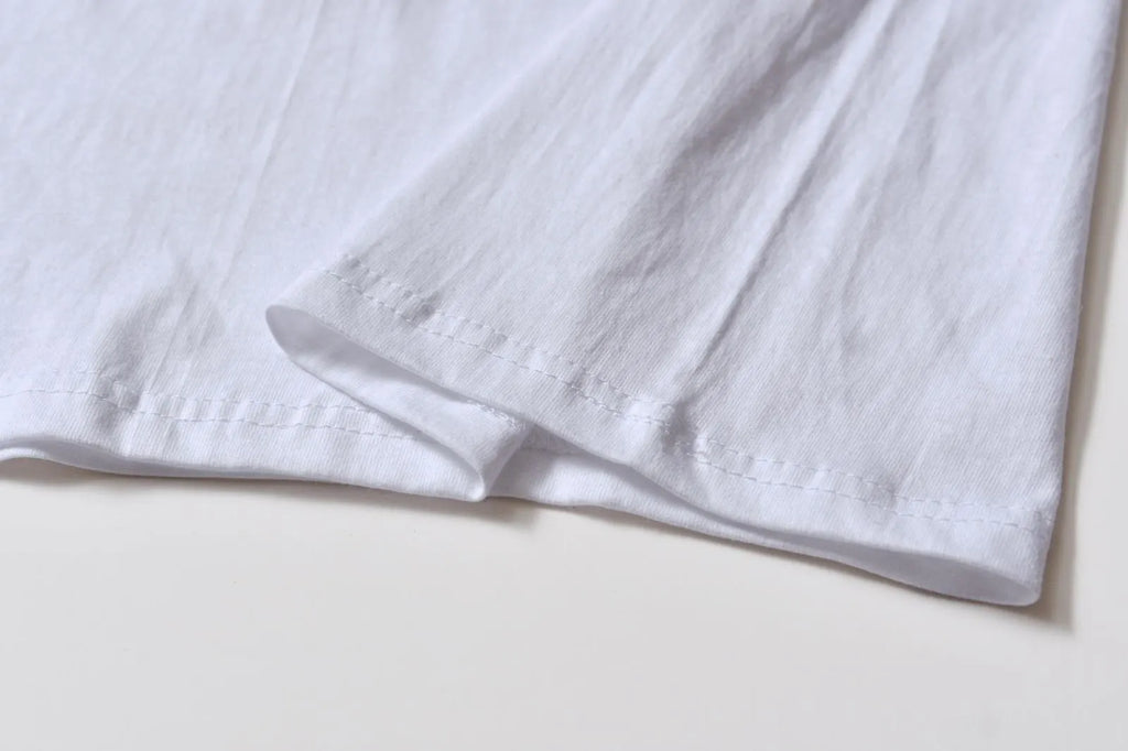 White cotton overalls with pattern design, short sleeves and round neckline for teenage summer wear