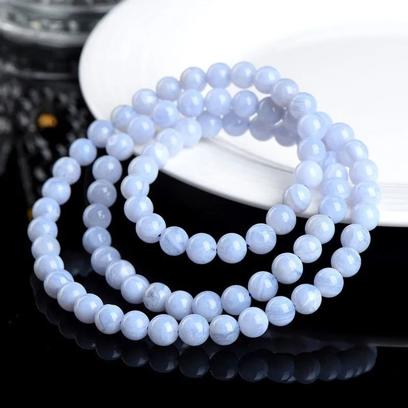 Handmade blue agate bracelet with natural pattern agate balls and striped scattered beads.