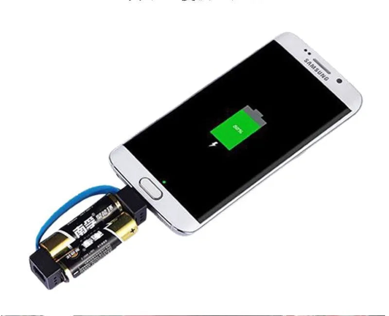 Portable emergency phone charger with 17x17mm plastic shell, powered by 2 AA dry batteries, shown in black, red, and blue.