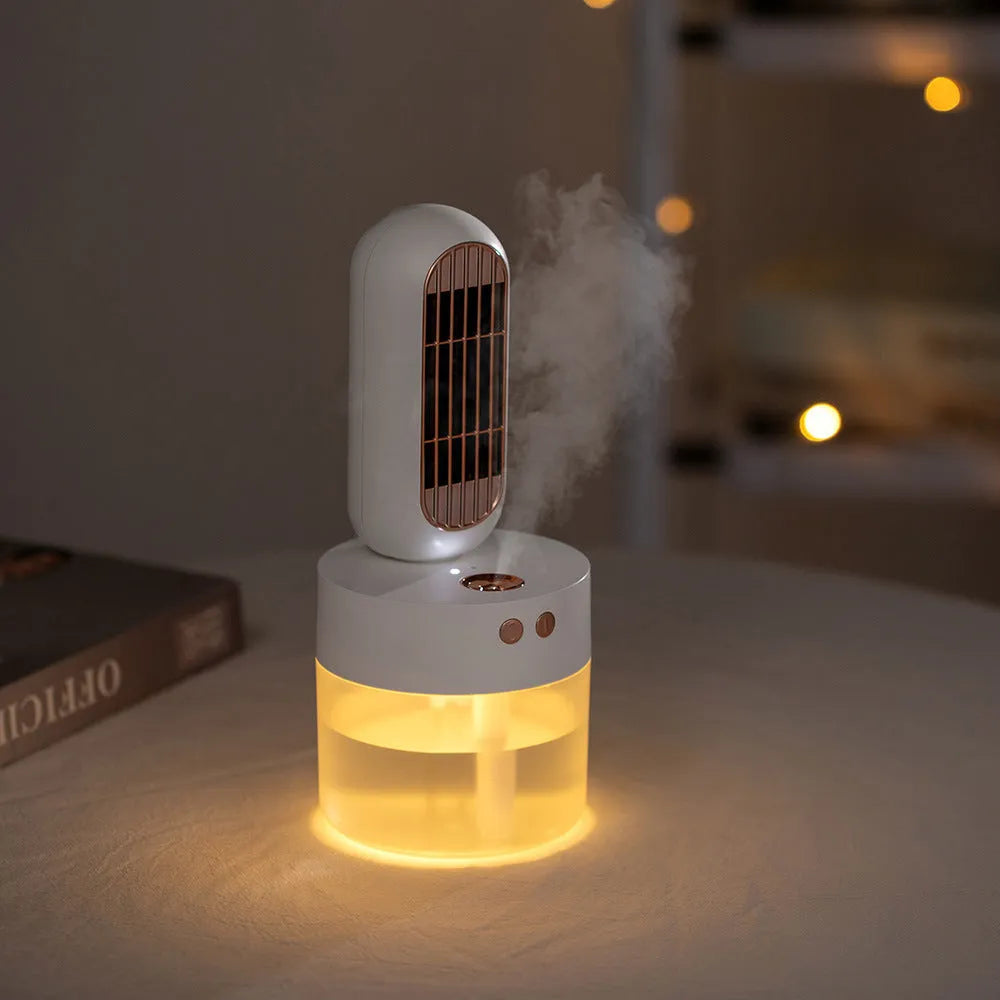 Small black and white humidifier fan with an oscillating head on a desk.