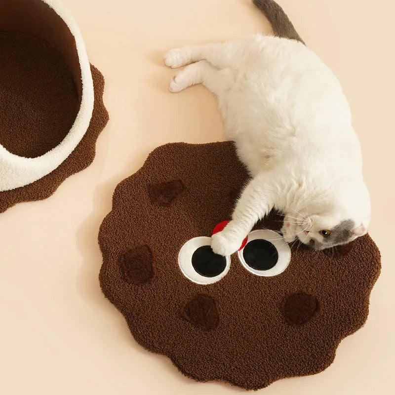 Khaki coloured nest-shaped enclosed cat house for winter sleeping.